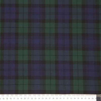 Tartan pattern with green and purple colors on a dark polyviscose fabric with a cm ruler