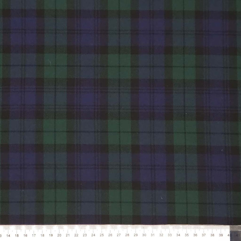 Tartan pattern with green and purple colors on a dark polyviscose fabric with a cm ruler