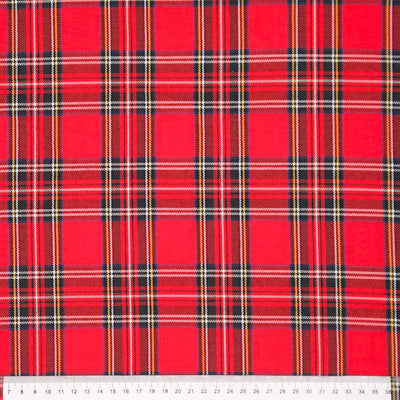 Red tartan fabric pattern on polyviscose fabric with a cm ruler