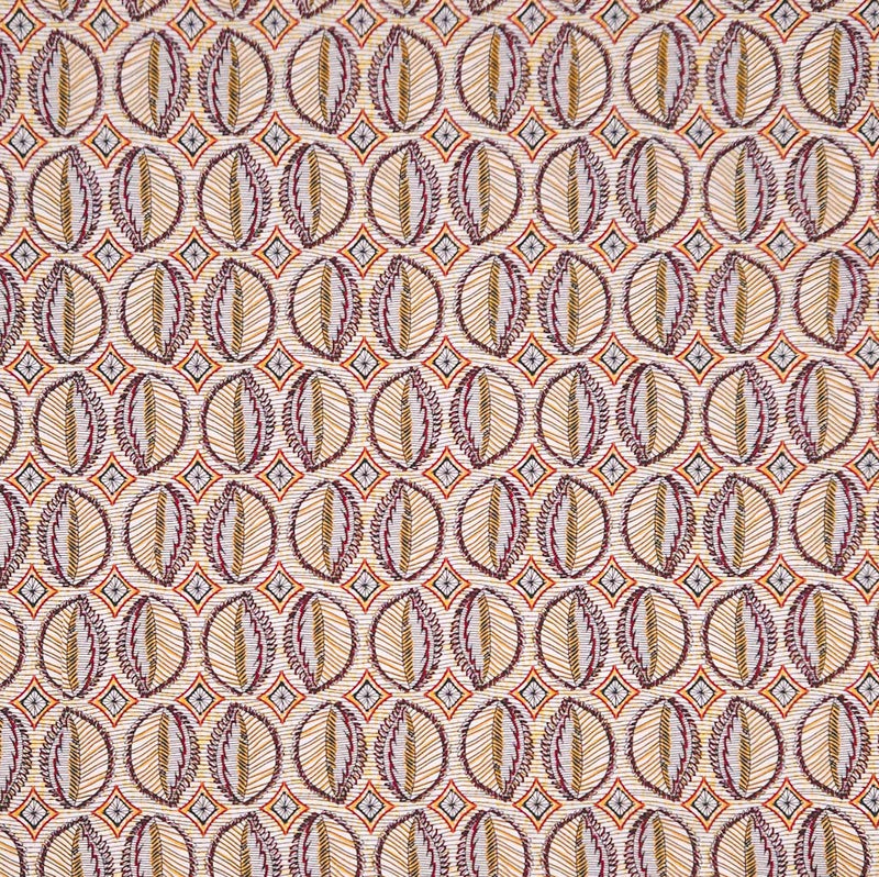 Patterned viscose fabric with circular shapes in brown, beige, and orange on a beige background