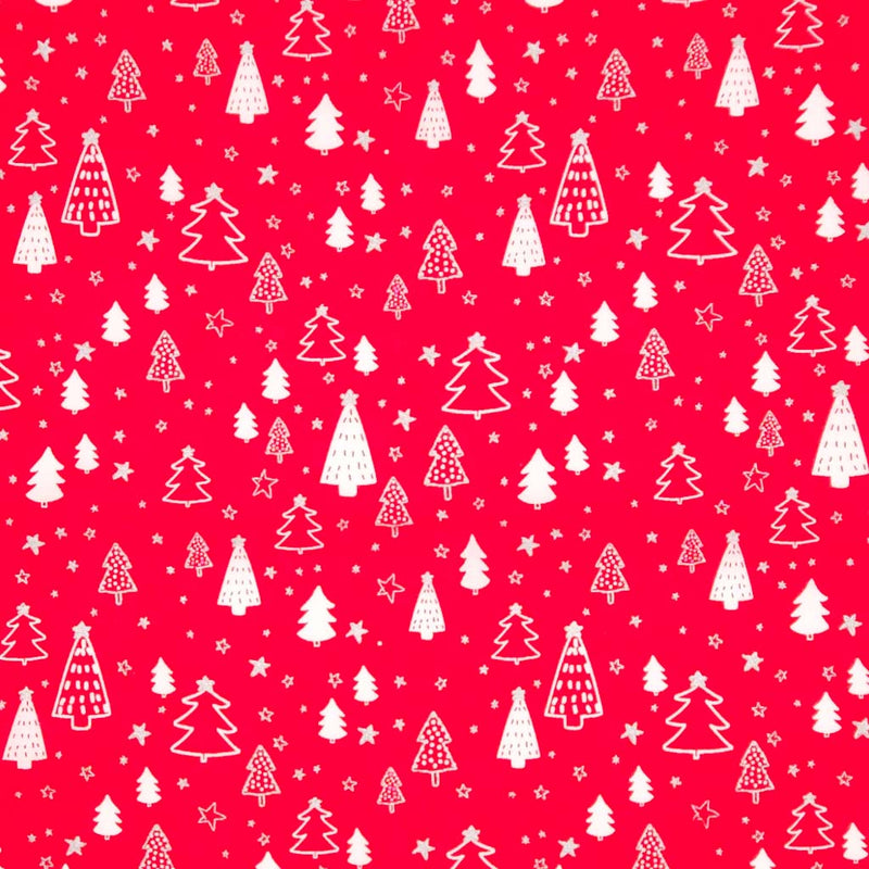 Pattern of white Christmas trees and stars on a red cotton fabric