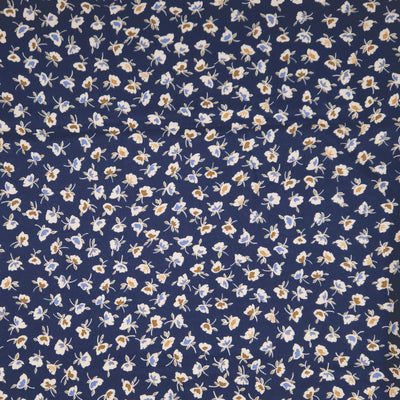 Navy blue fabric with small white floral pattern