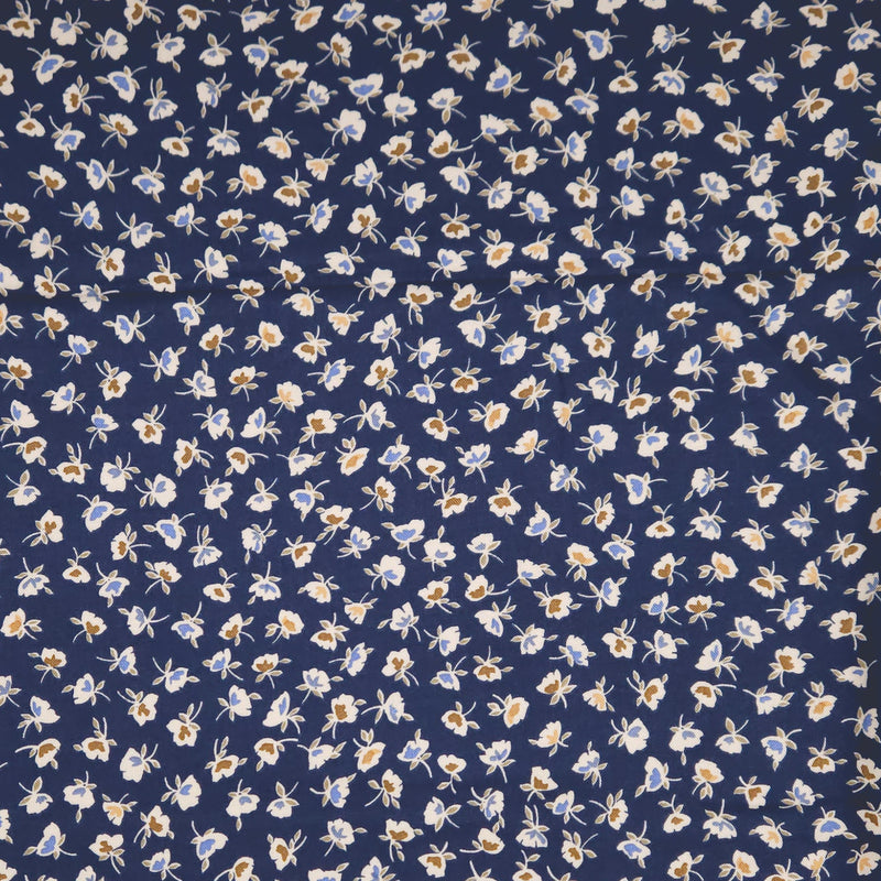 Navy blue fabric with small white floral pattern