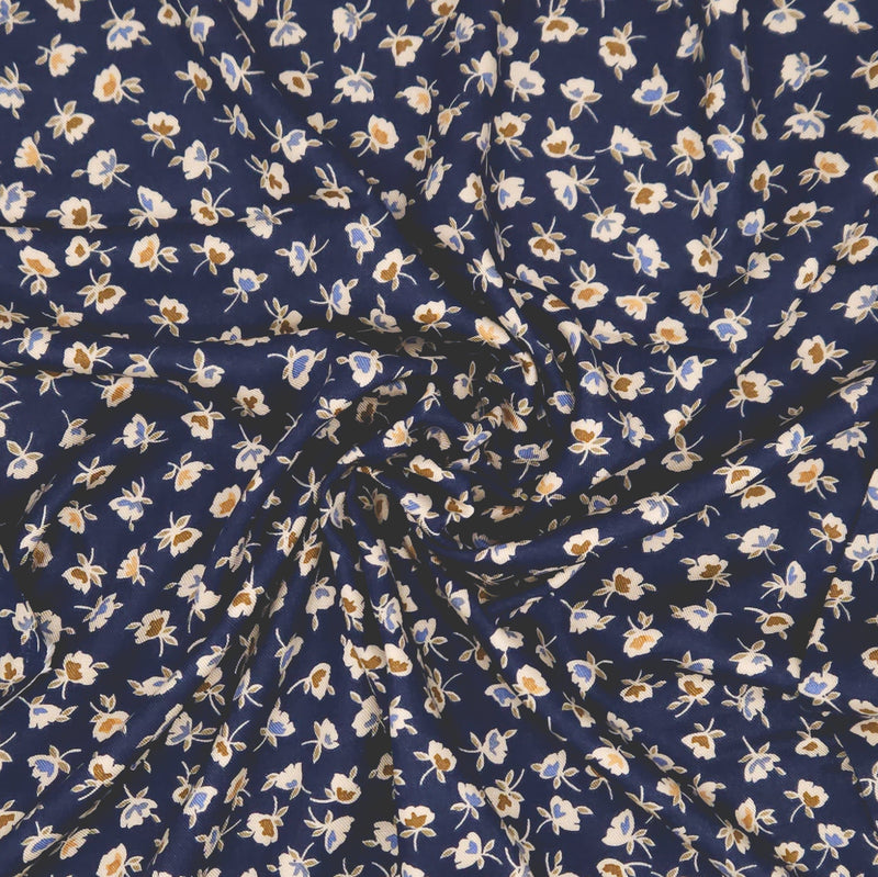 Floral fabric with small flowers on a blue background