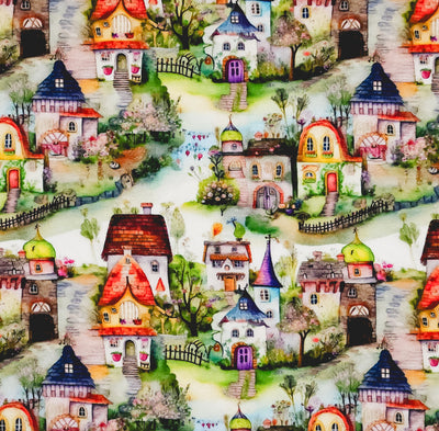 A quaint village scene printed on a cotton jersey fabric
