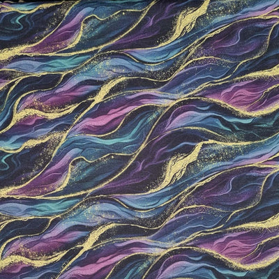 Waves in gold, purple and teal are printed on a jersey fabric