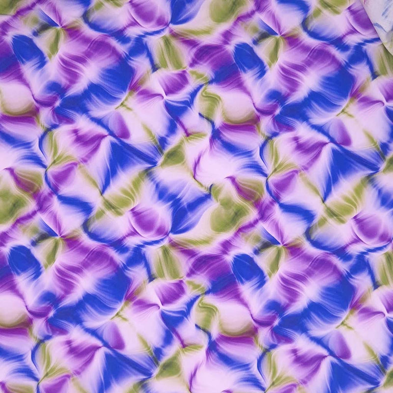A liquid ink design in purple and green, printed on a viscose dressmaking fabric