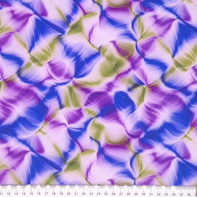 A liquid ink design in purple and green, printed on a viscose dressmaking fabric with a cm ruler