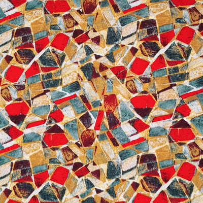An abstract mosaic print on a woven viscose fabric in reds and teals