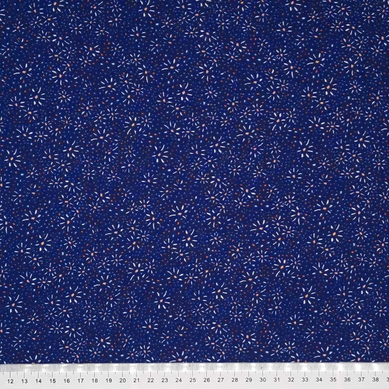 A firework shaped flower printed on a navy viscose fabric with a cm ruler