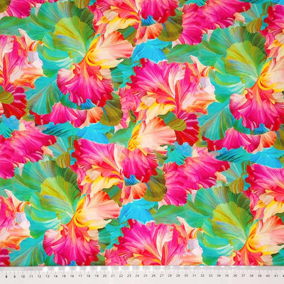 Delicate pink and orange petals with turquoise and green leaves printed on a viscose fabric with a cm ruler