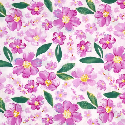 Pretty lilac coloured flowers are printed on an ivory woven viscose fabric.