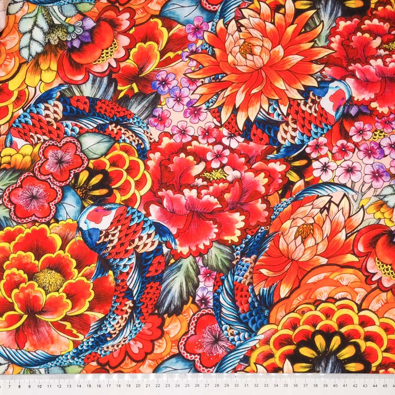 A vibrant oriental scene with flowers and koi carp is printed on a viscose fabric with a cm ruler