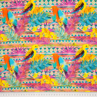 Parakeets are printed on a bright tropical viscose fabric with a cm ruler