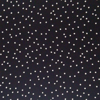 Small scattered white spots printed on black viscose fabric