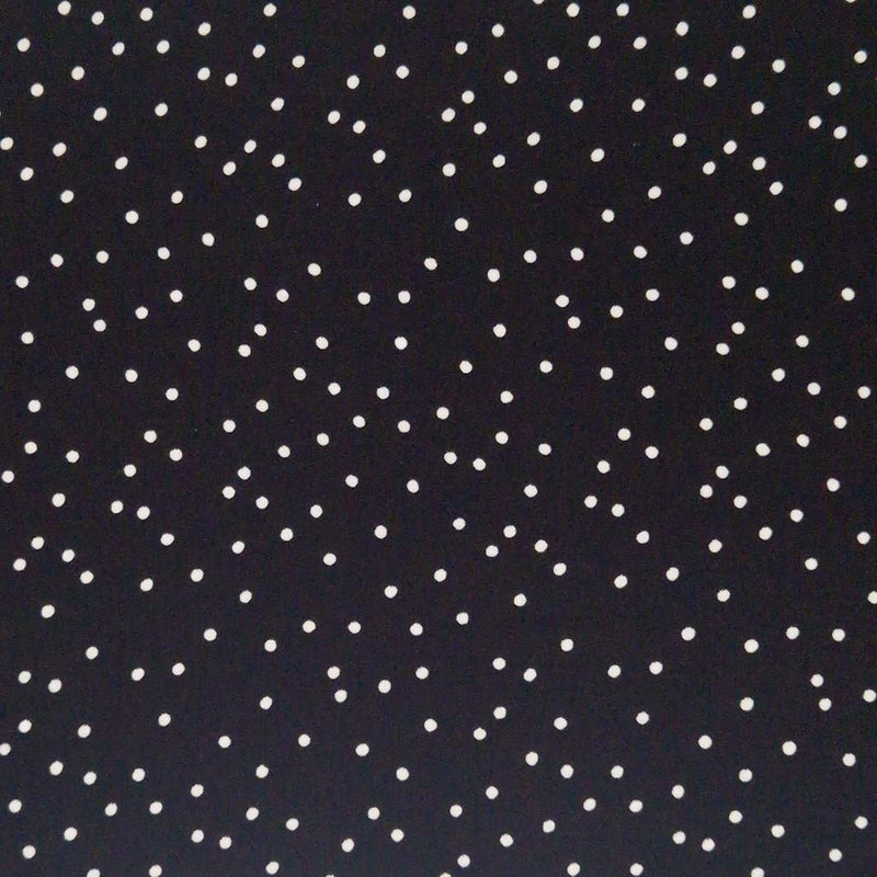 Small scattered white spots printed on black viscose fabric