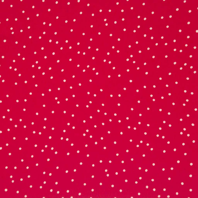 Small scattered white spots printed on red viscose fabric