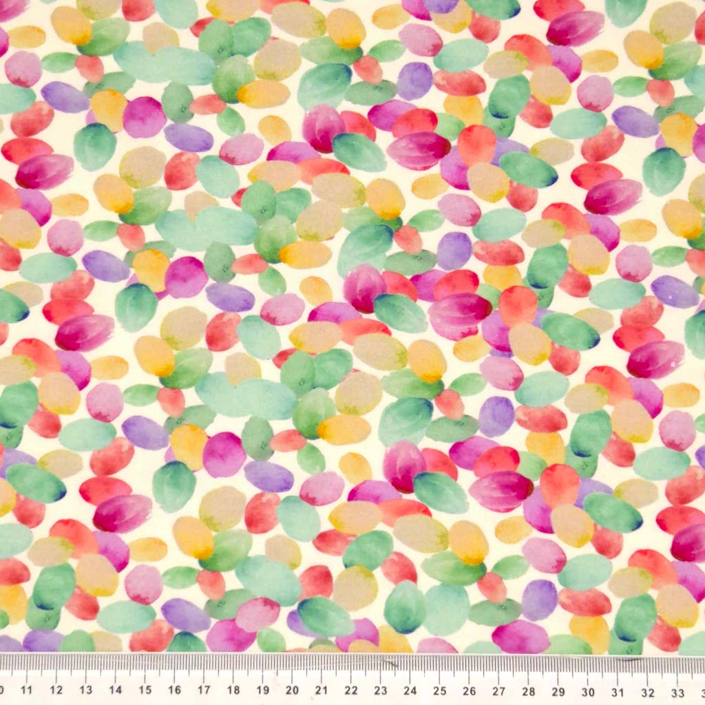 Watercolour petals printed on a viscose jersey fabric with a cm ruler