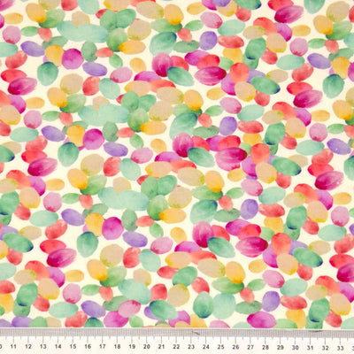 Watercolour petals printed on a viscose jersey fabric with a cm ruler