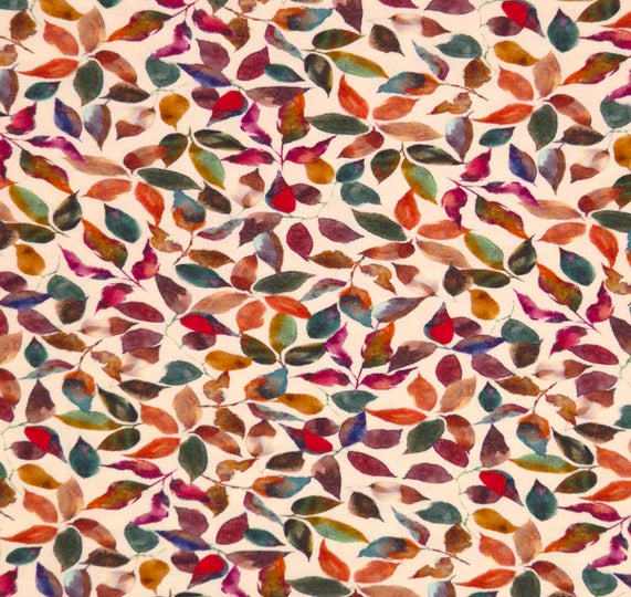 Autumnal leaves printed on a beige viscose jersey fabric