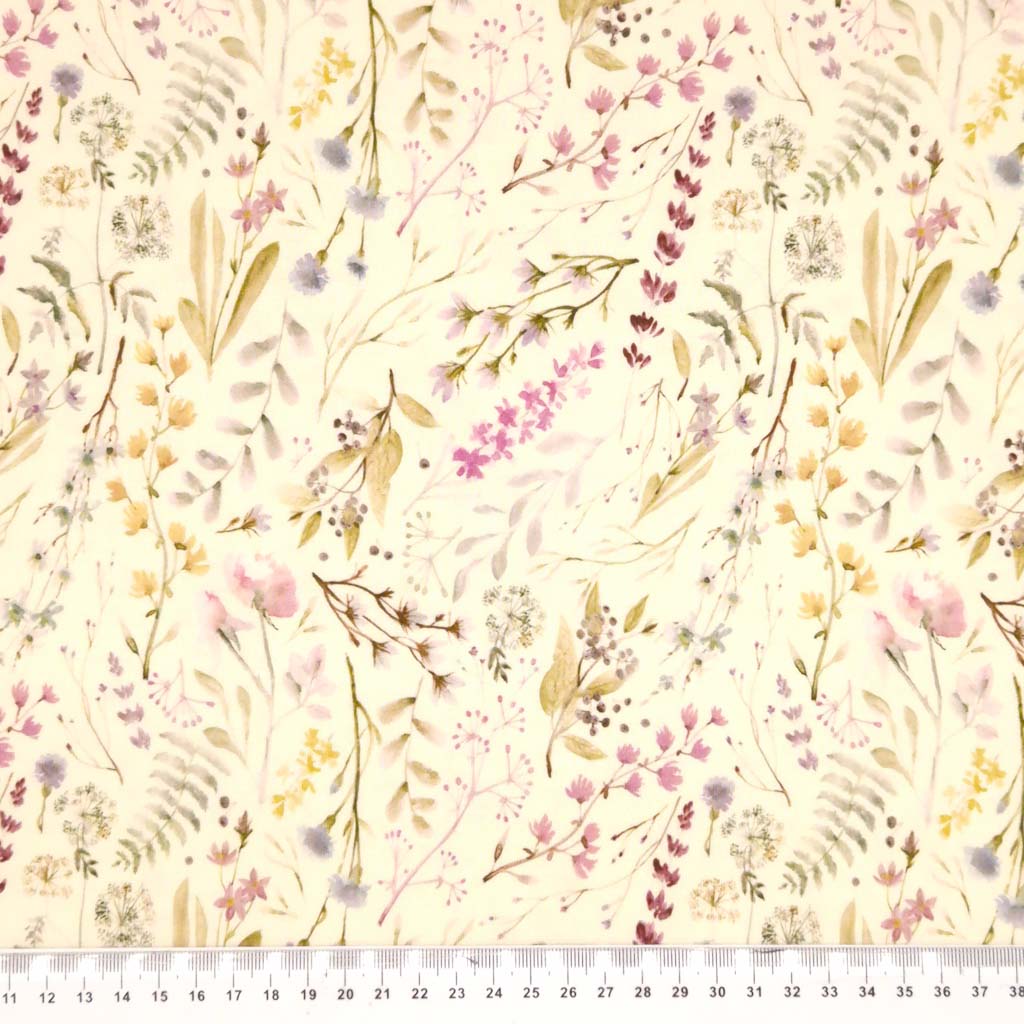 Delicate flower patterns in beige and pastels digitally printed on to a cream viscose jersey with a cm ruler