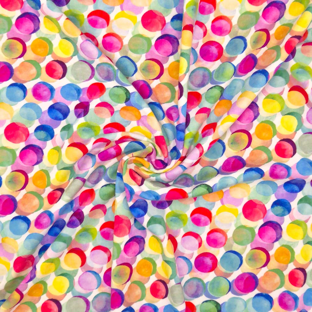 Watercolour painted colourful spots printed on a viscose jersey fabric