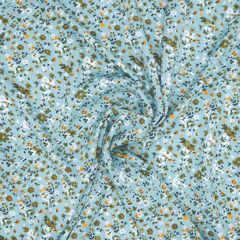 Floral fabric pattern with small flowers on a duck egg viscose fabric