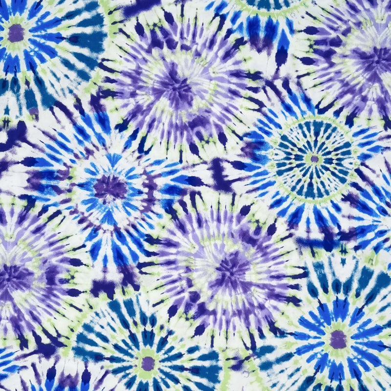 A lilac and green tie dye pattern printed on a viscose challis fabric