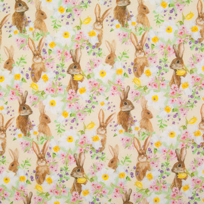 Inquisitive little bunny rabbits hiding amongst daffodils are printed on a fat quarter of cotton fabric