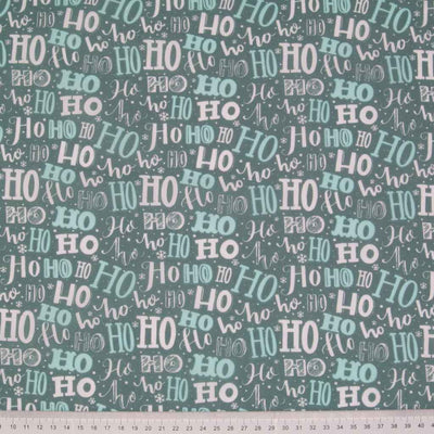 Christmas Ho Ho Mash Up & Mini Snowflakes on Green - Polycotton
