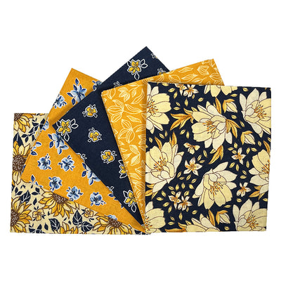 A fat quarter bundle of five cotton sunflower prints in navy and ochre