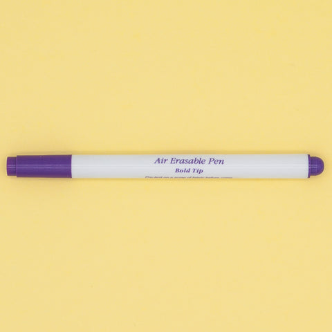 A purple and white bold tipped air drying fabric marker