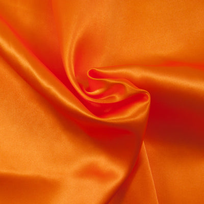 A bright orange budget satin fabric