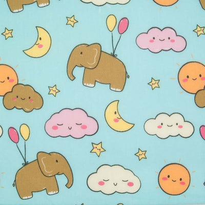 Blue elephants, pink and yellow balloons with orange sunshine and yellow moons printed on a sky blue polycotton fabric