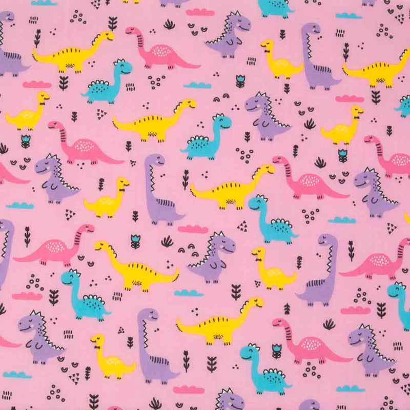 Yellow, pink and lilac happy dinosaurs printed on a pink polycotton fabric.