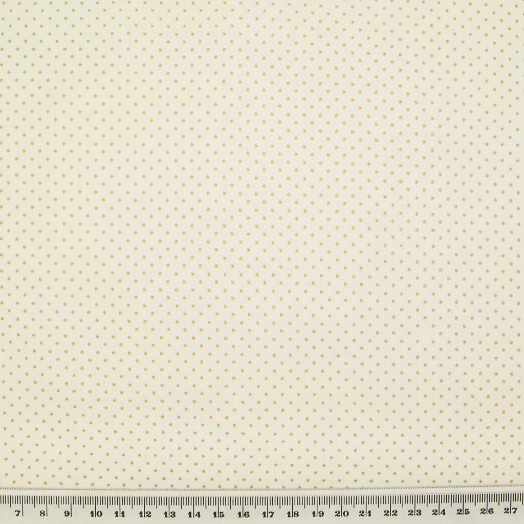 2mm gold lacquer pin spots are printed on an ivory cotton christmas fabric with a cm ruler at the bottom