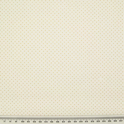 2mm gold lacquer pin spots are printed on an ivory cotton christmas fabric with a cm ruler at the bottom