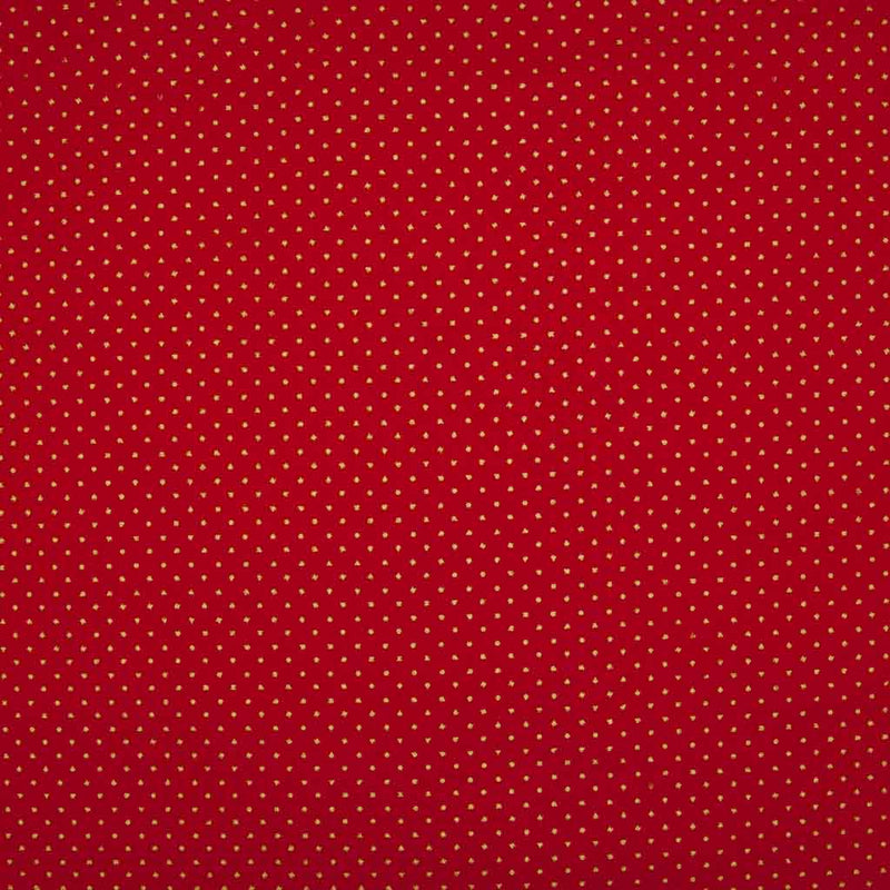 2mm gold lacquer pin spots are printed on a red cotton christmas fabric