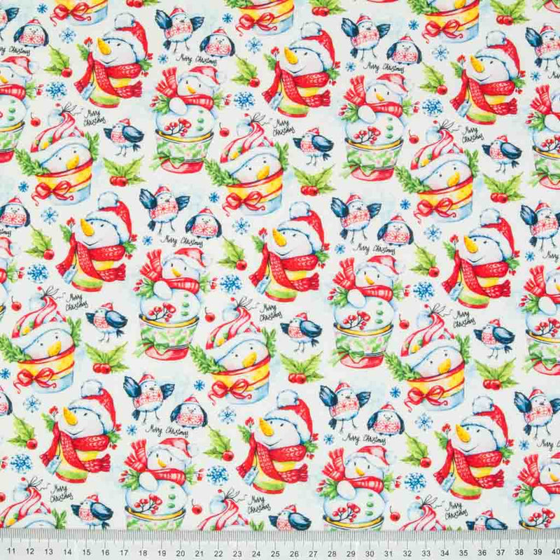 Festive snowmen and robins are printed on a quality, 100% cotton fabric in a white, red and green colourway with a cm ruler at the bottom