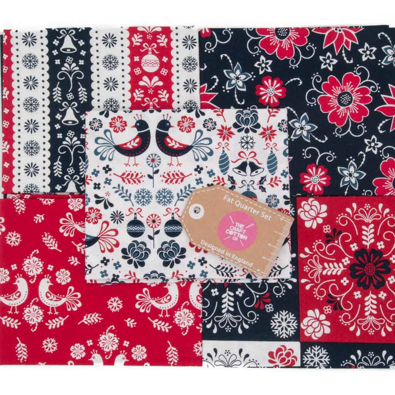 Five cotton fat quarters in navy, red and white colours are printed with scandinavian style festive designs