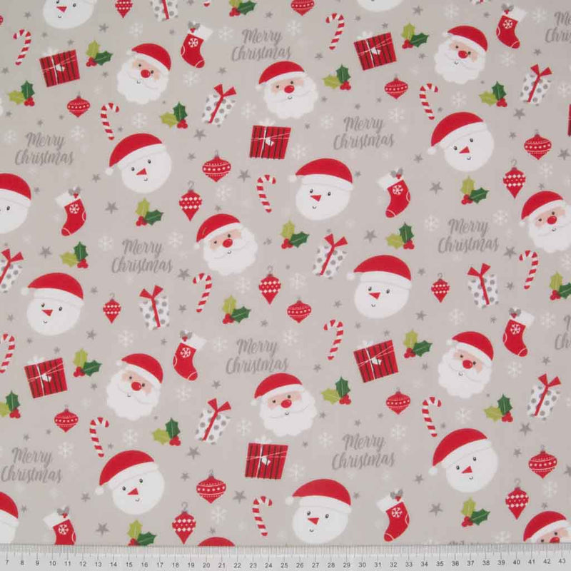 A fun festive scene of santa, snowmen and gifts printed on silver polycotton fabric. with a cm ruler at the bottom