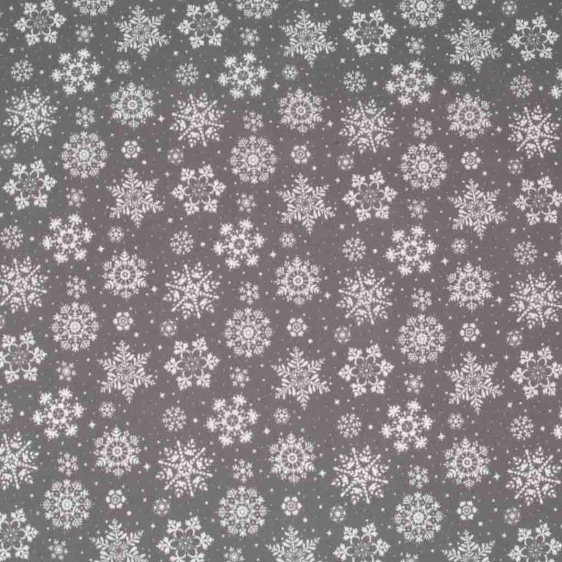 Pretty white intricate snowflakes printed on a grey polycotton fabric