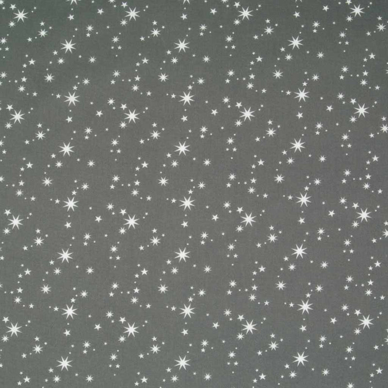 White christmas stars printed on a grey polycotton fabric.