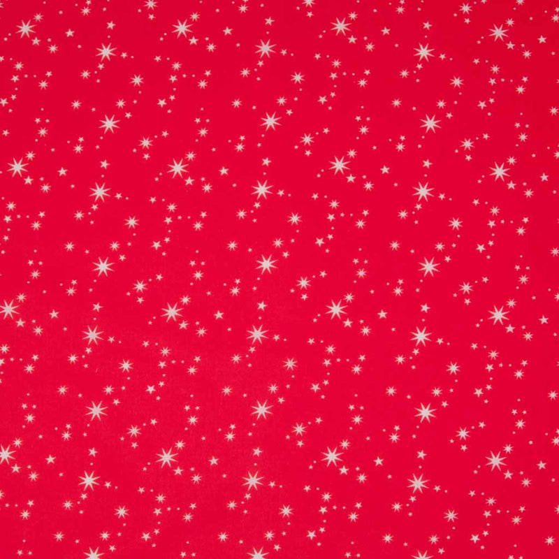 White christmas stars printed on a red polycotton fabric.