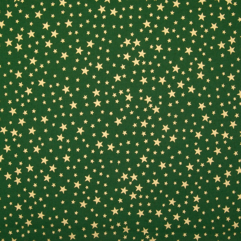 A green christmas cotton fabric featuring small metallic gold stars in a tossed pattern