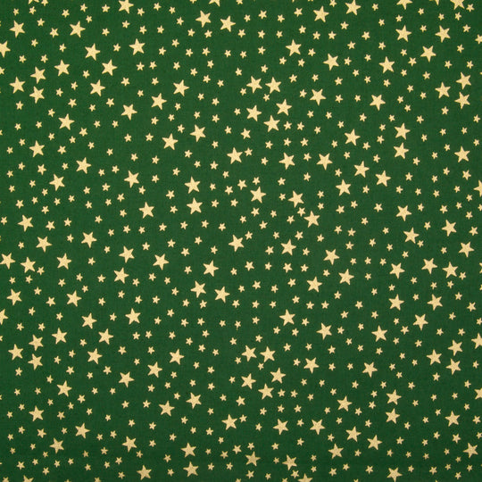 A green christmas cotton fabric featuring small metallic gold stars in a tossed pattern