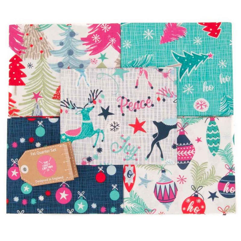 Reindeer,  baubles and christmas trees are printed in pink, navy and aqua colourways  on 100% cotton fabric fat quarters