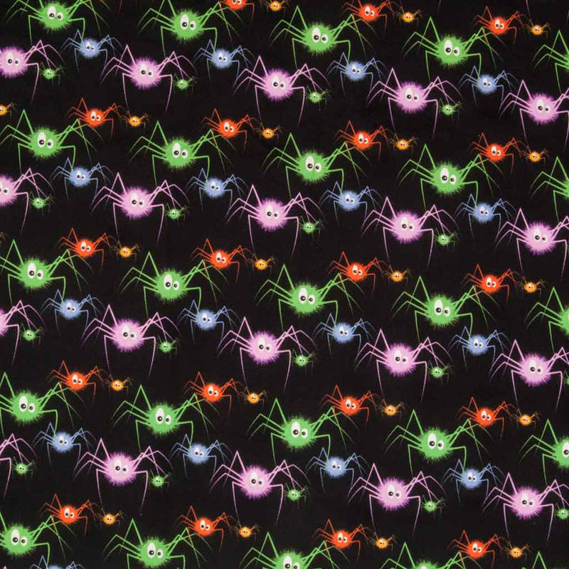 Bright purple, green and orange spiders are printed on a black 100% cotton halloween fabric