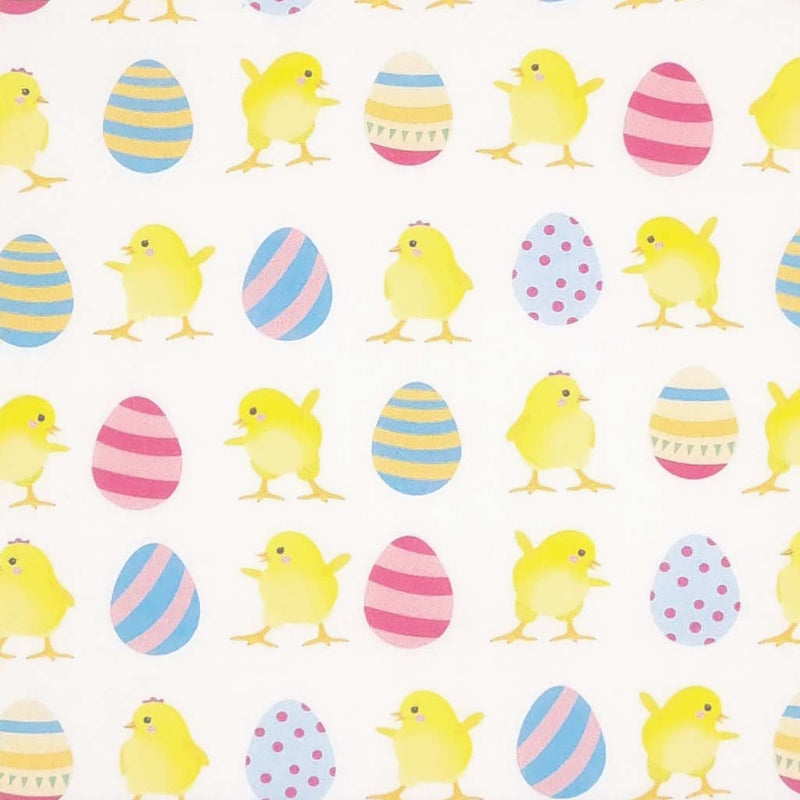 Easter eggs and chicks are printed on an ivory cotton fabric by Rose & Hubble