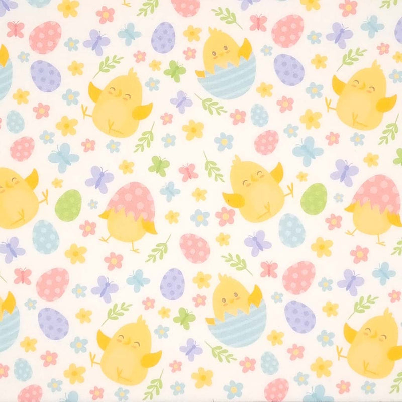 Easter chicks, flowers and eggs are printed on a white cotton fabric by Rose & Hubble